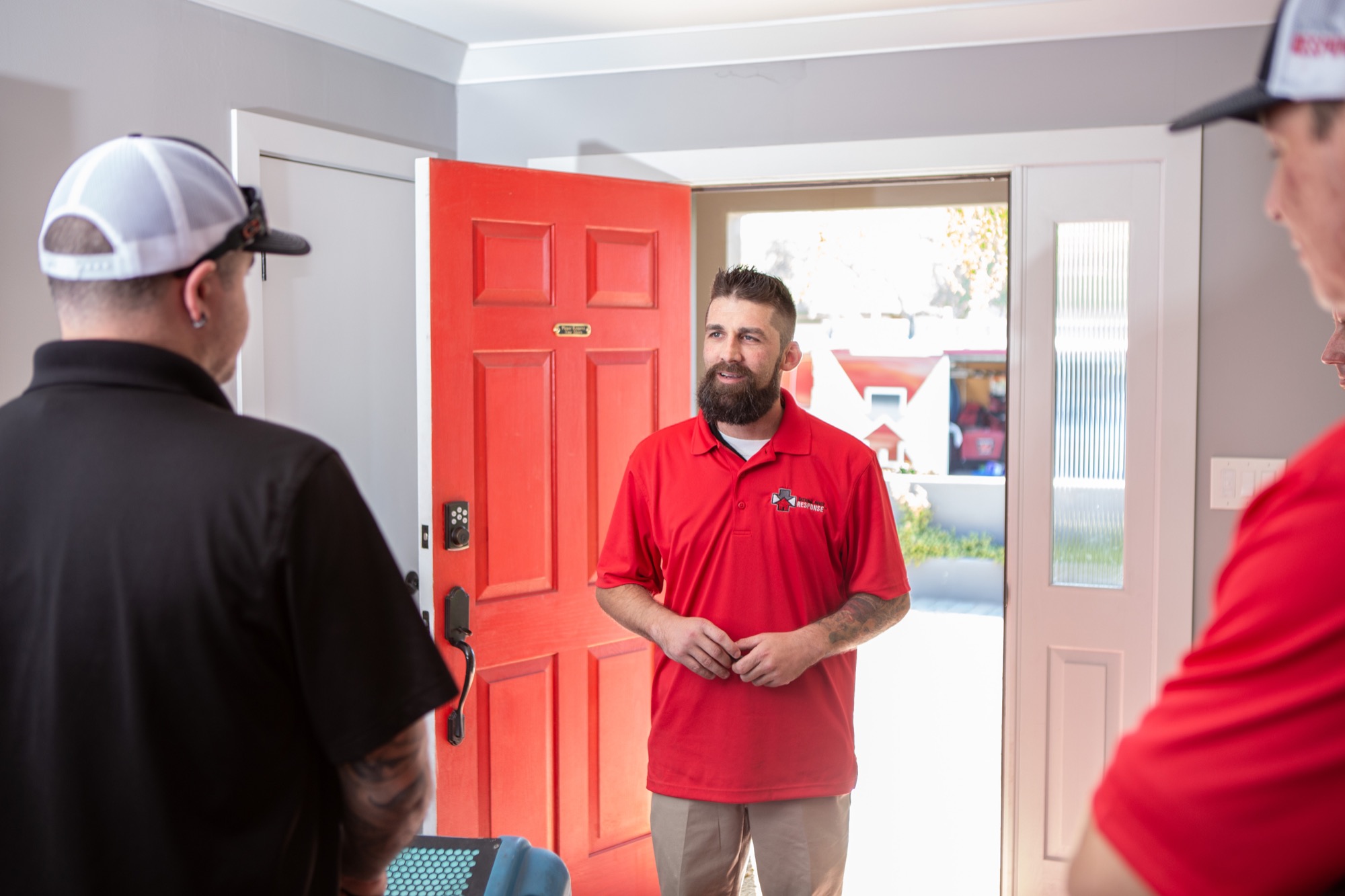 National First Response technician greeting a homeowner at their front door