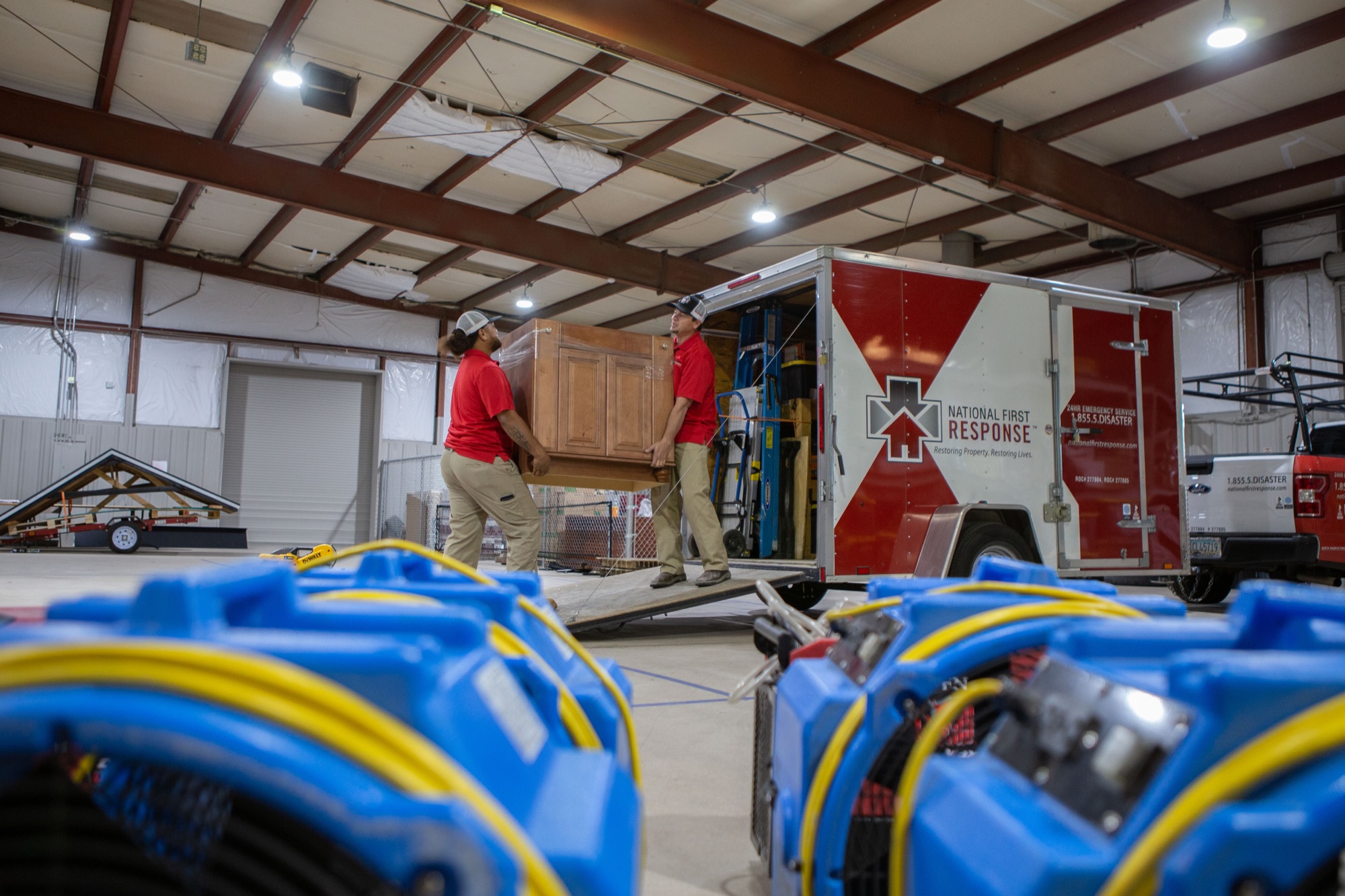 National First Response technicians loading restoration equipment for a commercial job
